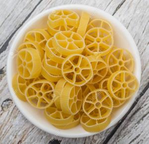53389409 Dried Wagon Wheel Shape Pasta Or Rotelle Pasta In White Bowl Over Wooden Backgroundjpg — Tipi di Pasta option 2